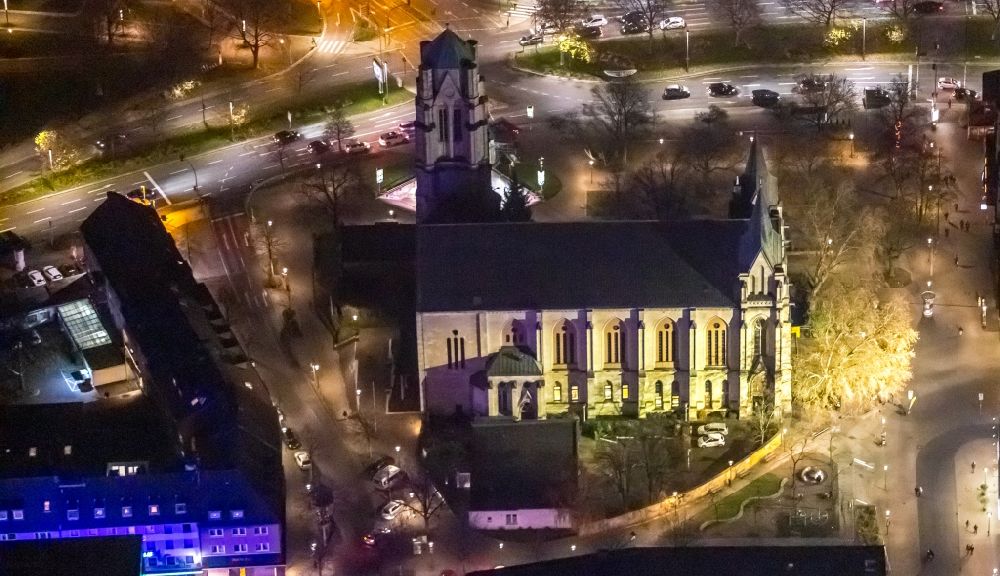 Essen at night from the bird perspective: Night lighting church building St. Gertrud on Rottstrasse in Essen in the state North Rhine-Westphalia, Germany