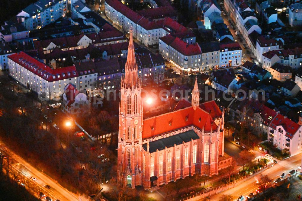 Aerial photograph at night München - Night lighting church building Heilig-Kreuz-Kirche on street Gietlstrasse in the district Giesing in Munich in the state Bavaria, Germany