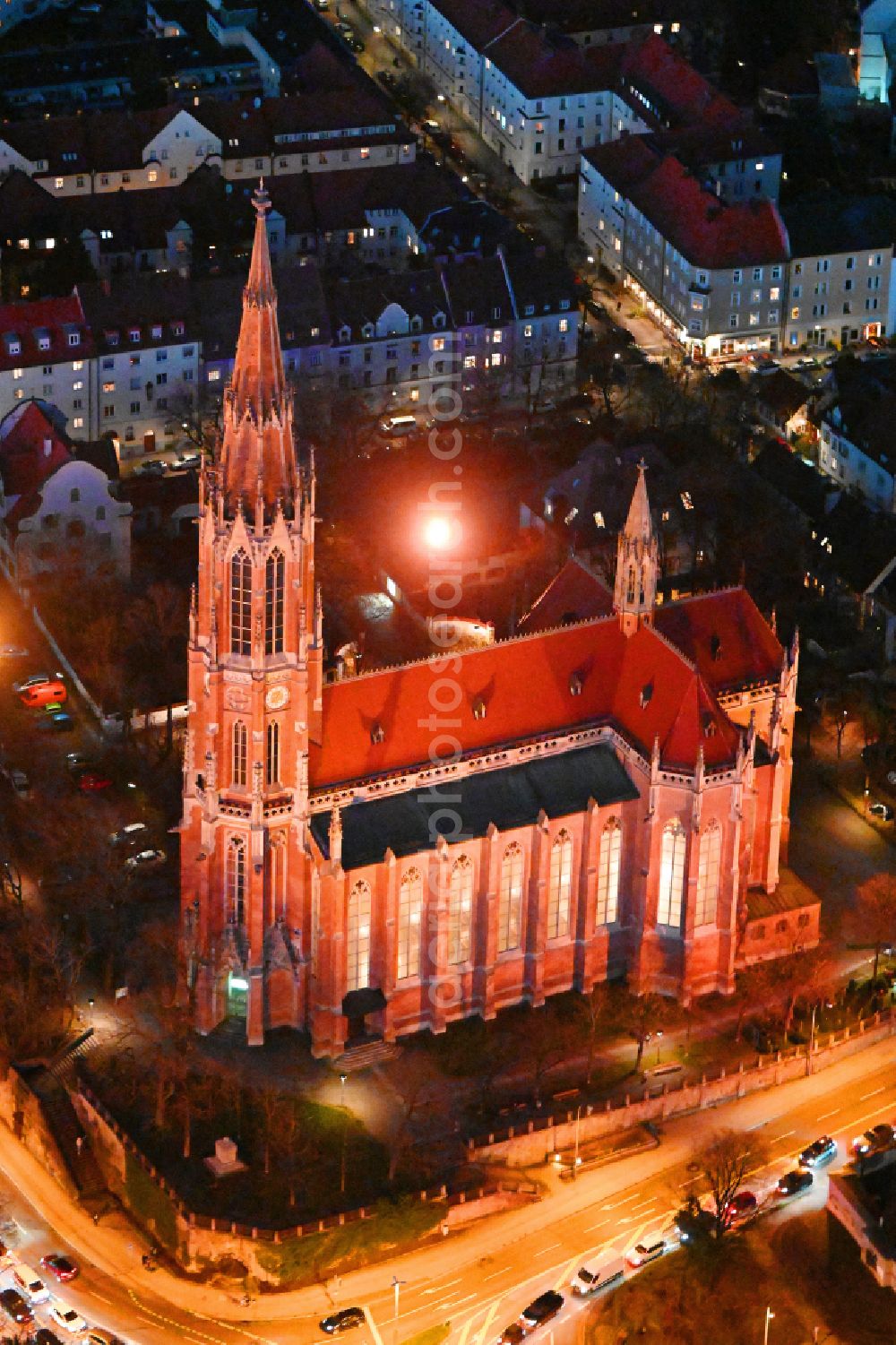 Aerial image at night München - Night lighting church building Heilig-Kreuz-Kirche on street Gietlstrasse in the district Giesing in Munich in the state Bavaria, Germany