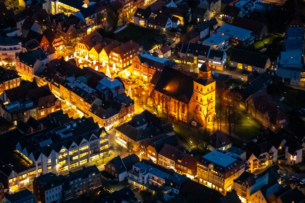Ahlen at night from above - Night lighting church building of the Catholic parish of St. Bartholomew in the old city center of the city center in Ahlen in the federal state of North Rhine-Westphalia, Germany