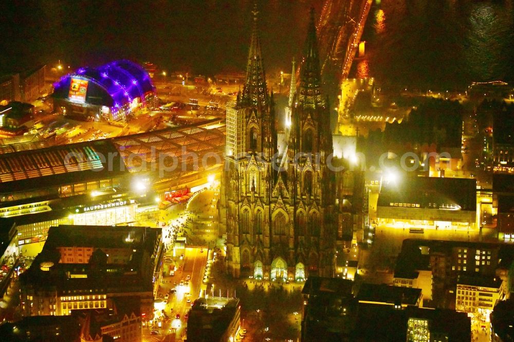 Aerial photograph at night Köln - Night lighting church building Koelner Dom in the old town center in the district Innenstadt in Cologne in the state North Rhine-Westphalia - NRW, Germany