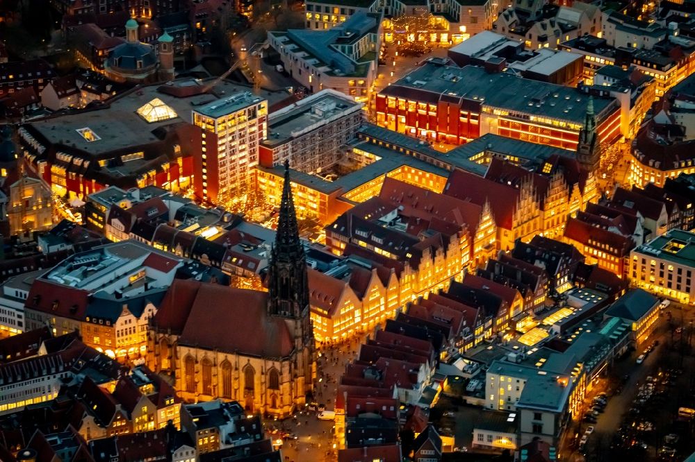 Aerial image at night Münster - Night lighting Church building in St. Lonberti-Kirche on Place Lambertikirchplatz on Old Town- center of downtown in Muenster in the state North Rhine-Westphalia, Germany