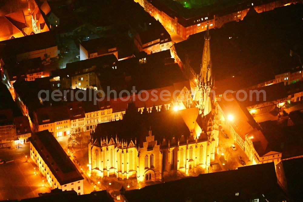 Aerial image at night Mühlhausen - Night lighting church building in of Marienkirche Old Town- center of downtown in Muehlhausen in the state Thuringia, Germany