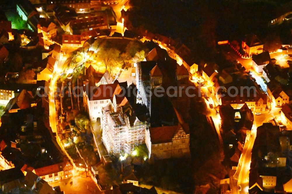 Aerial image at night Quedlinburg - Night lighting church building in of Stiftskirche Schlosskirche - St.Servatii on Schlossberg Old Town- center of downtown in Quedlinburg in the state Saxony-Anhalt, Germany
