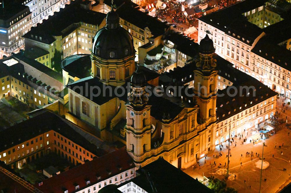Aerial image at night München - Night lighting church building in the Theatinerkirche also Catholic Collegiate Church of St. Cajetan called in Munich in Bavaria