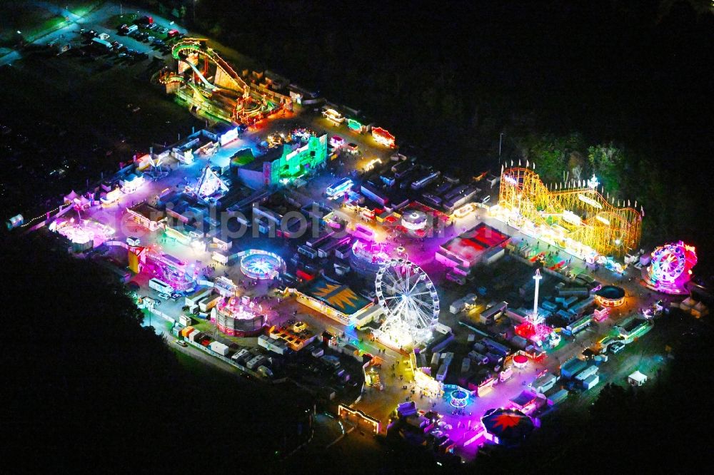Aerial photograph at night Berlin - Night lighting fair - event location at festival on place Berlin Park on Kurt-Schumacher-Damm in the district Reinickendorf in Berlin, Germany