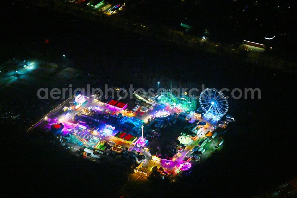 Berlin at night from above - Night lighting fair - event location at festival on place Berlin Park on Kurt-Schumacher-Damm in the district Reinickendorf in Berlin, Germany