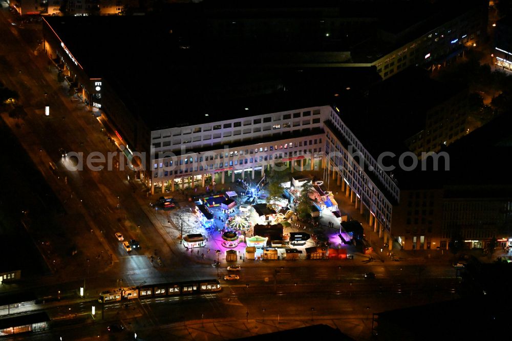 Berlin at night from above - Night lighting fun fair and fairground event area at the folk festival on Alice-Salomon-Platz at the city center Helle Mitte in the district of Hellersdorf in Berlin, Germany