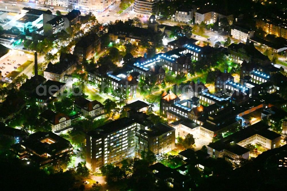 Aerial photograph at night Berlin - Night lighting hospital grounds of the Clinic DRK Kliniken Berlin Westend on Spandauer Damm in the district Westend in Berlin, Germany