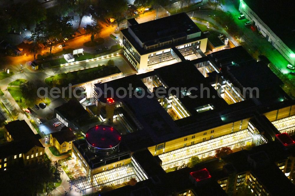 Aerial image at night Berlin - Night lighting hospital grounds of the accident clinic in the district Marzahn-Hellersdorf in Berlin