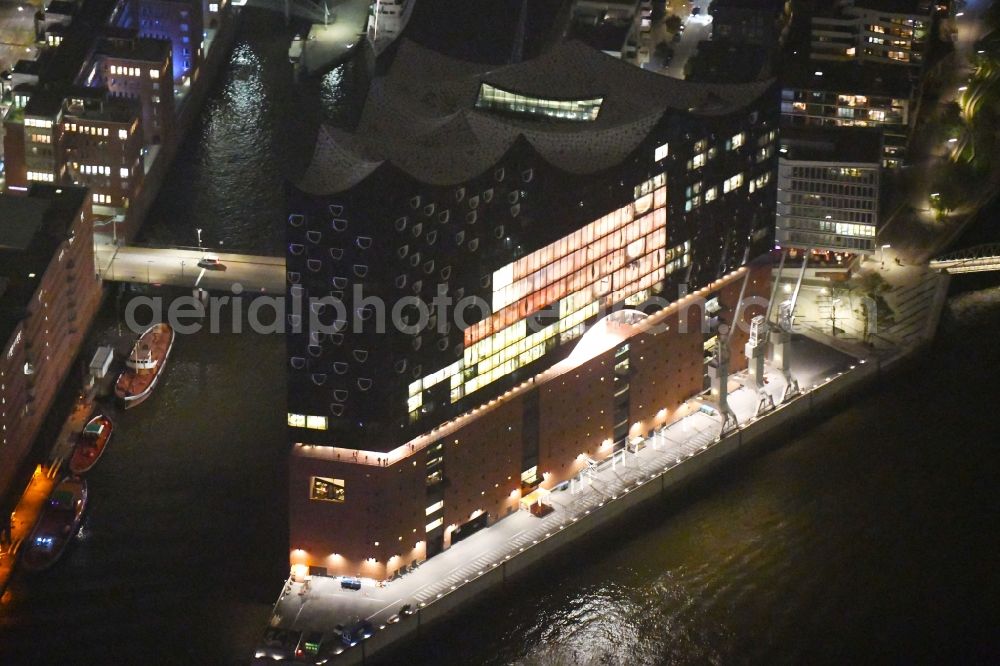 Hamburg at night from above - Night lighting The Elbe Philharmonic Hall on the river bank of the Elbe in Hamburg
