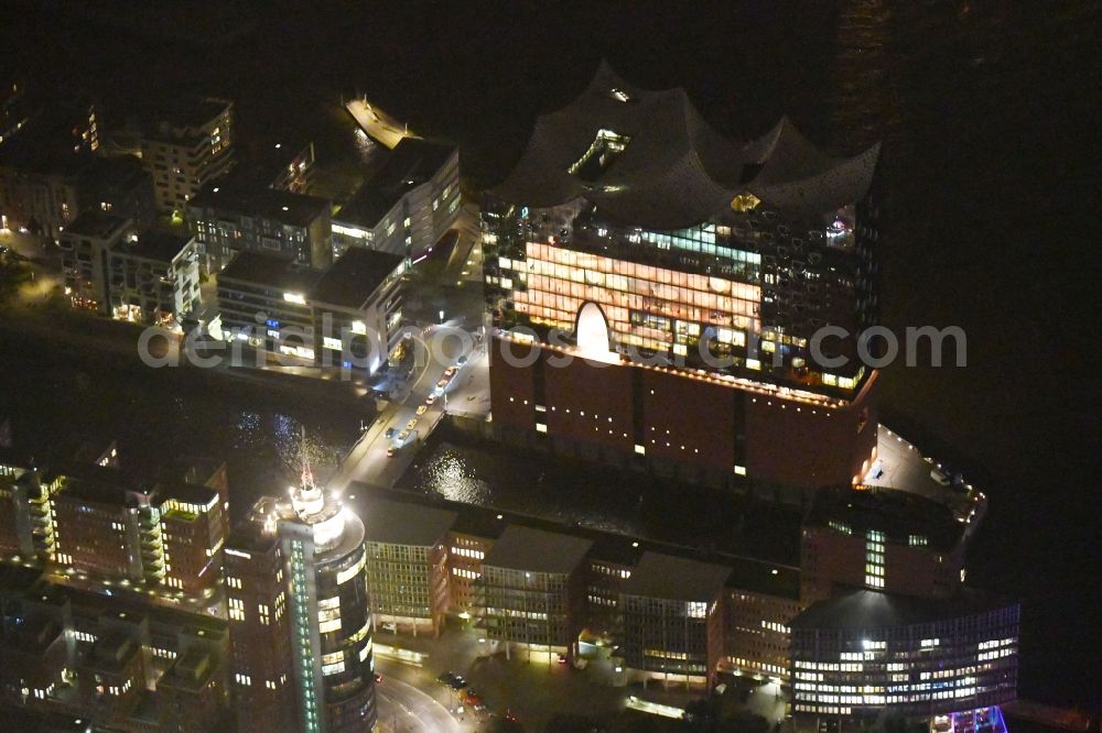 Aerial image at night Hamburg - Night lighting The Elbe Philharmonic Hall on the river bank of the Elbe in Hamburg