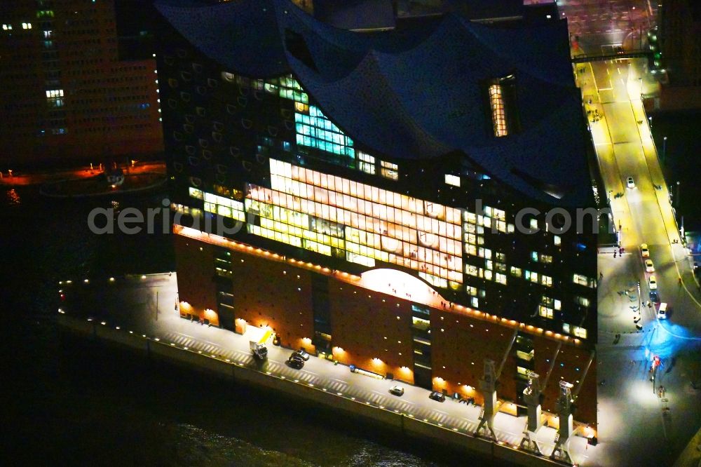 Hamburg at night from above - Night lighting The Elbe Philharmonic Hall on the river bank of the Elbe in Hamburg