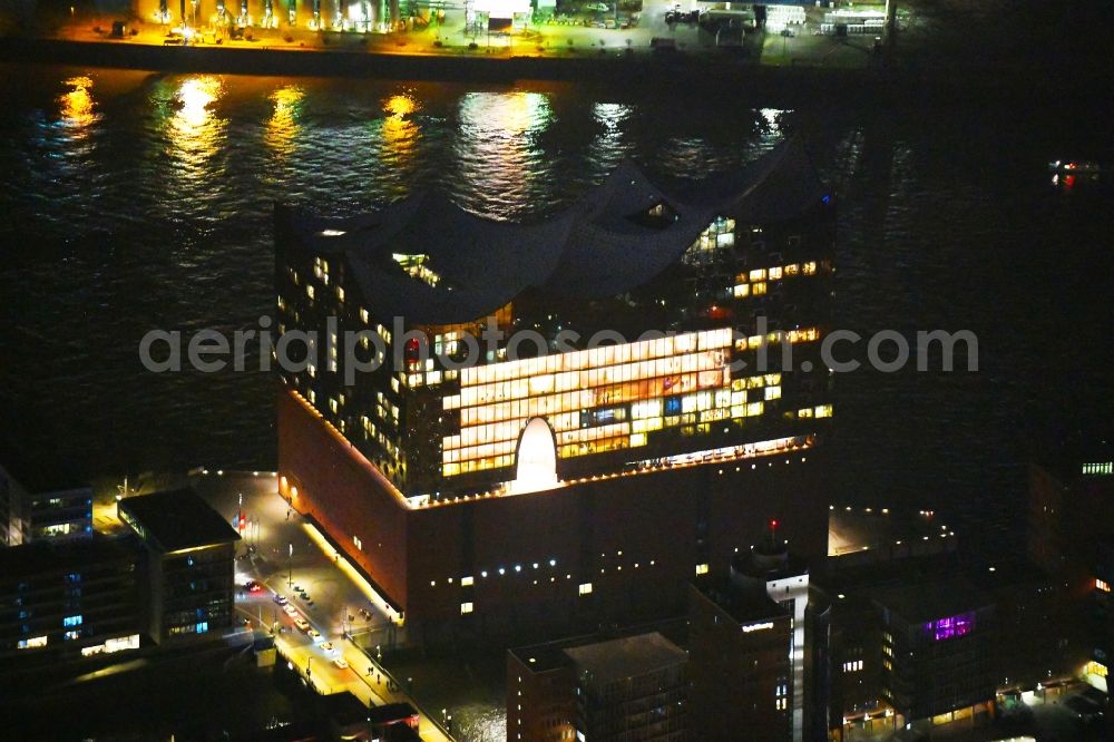 Aerial image at night Hamburg - Night lighting The Elbe Philharmonic Hall on the river bank of the Elbe in Hamburg