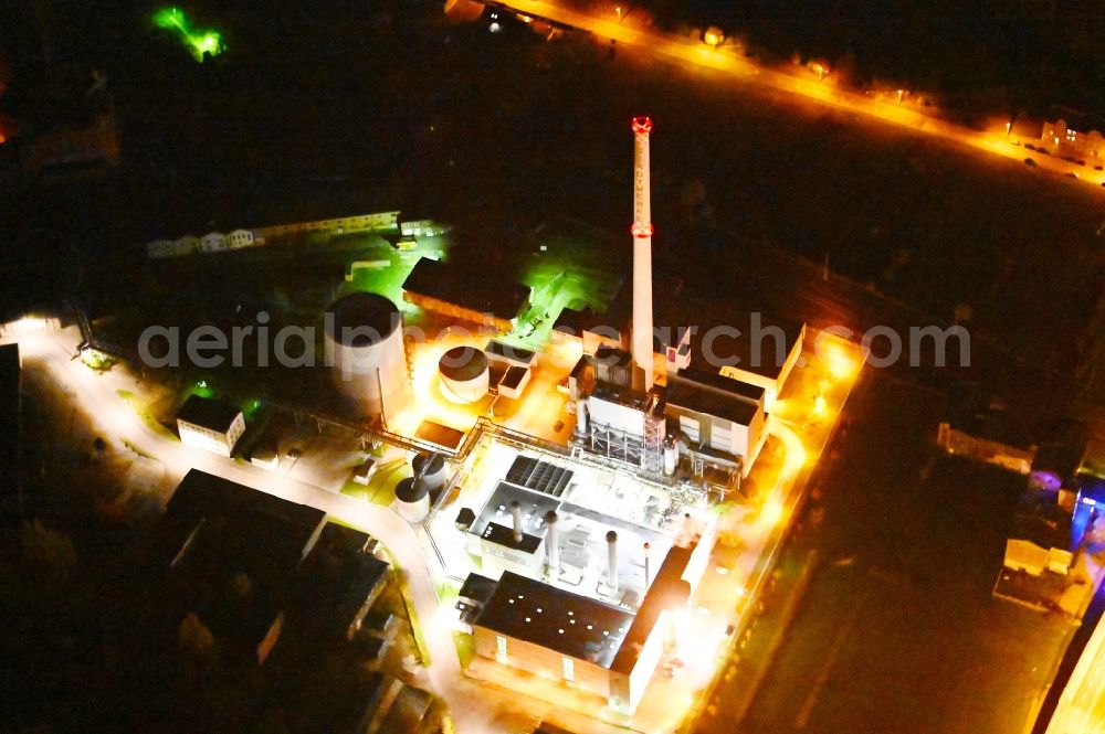 Dessau at night from the bird perspective: Night lighting power plants and exhaust towers of thermal power station in Dessau in the state Saxony-Anhalt, Germany