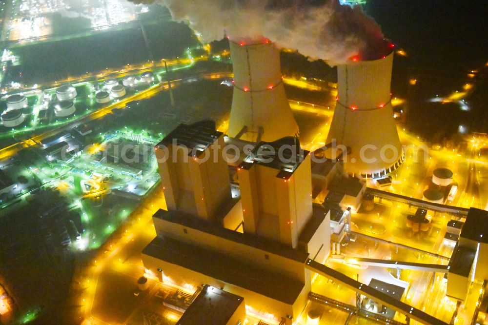 Aerial image at night Lippendorf - Night lighting power plants and exhaust towers of thermal power station of LEAG Lausitz Energie Kraftwerke AG in Lippendorf in the state Saxony, Germany