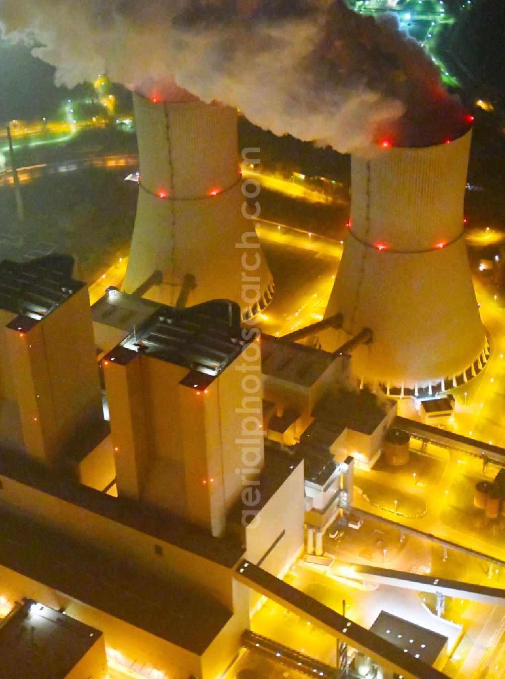 Lippendorf at night from above - Night lighting power plants and exhaust towers of thermal power station of LEAG Lausitz Energie Kraftwerke AG in Lippendorf in the state Saxony, Germany