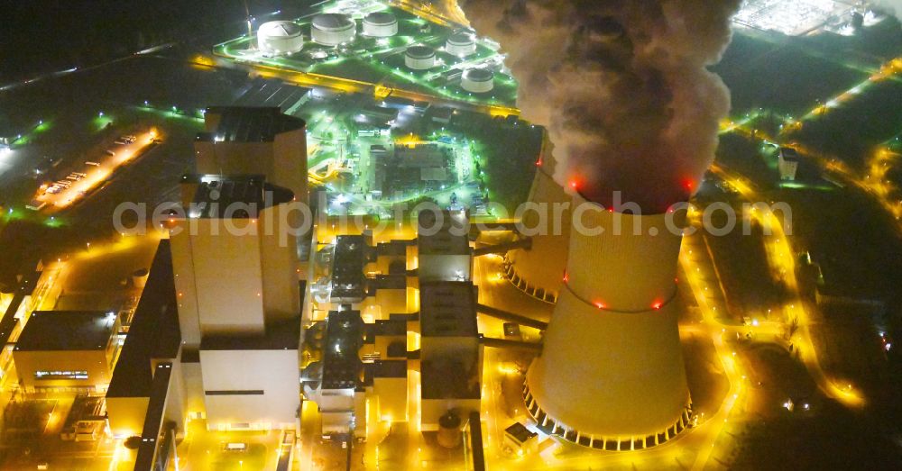 Aerial photograph at night Lippendorf - Night lighting power plants and exhaust towers of thermal power station of LEAG Lausitz Energie Kraftwerke AG in Lippendorf in the state Saxony, Germany