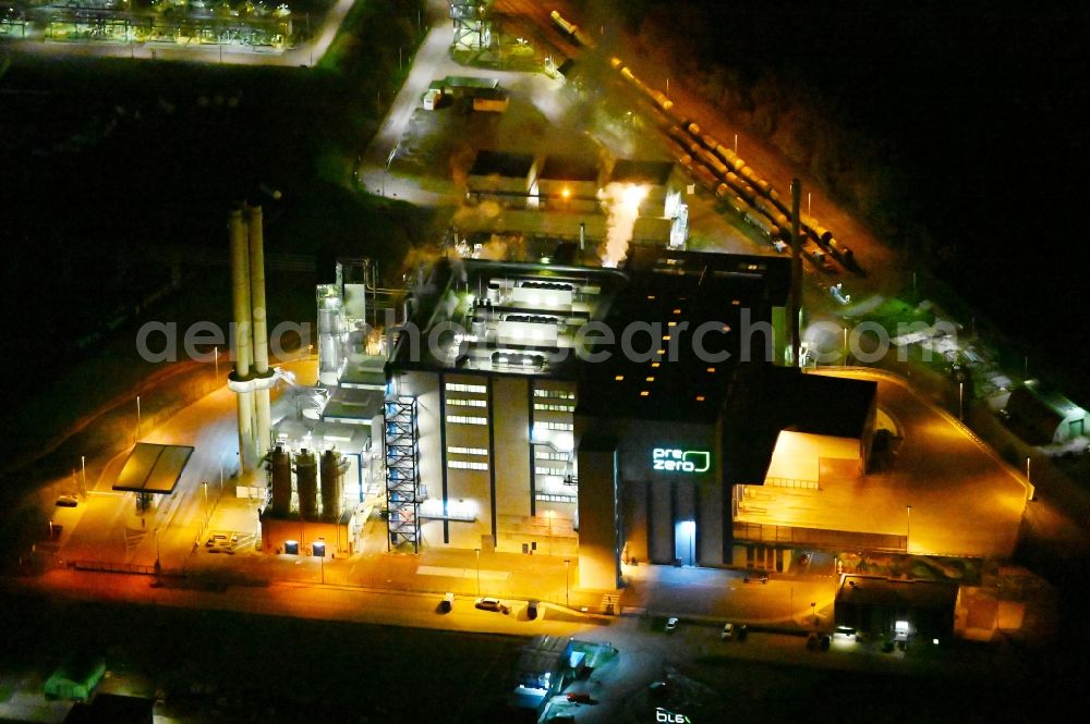 Bernburg (Saale) at night from above - Night lighting power plants and exhaust towers of Waste incineration plant station of Pre Zero Energy in Bernburg (Saale) in the state Saxony-Anhalt, Germany