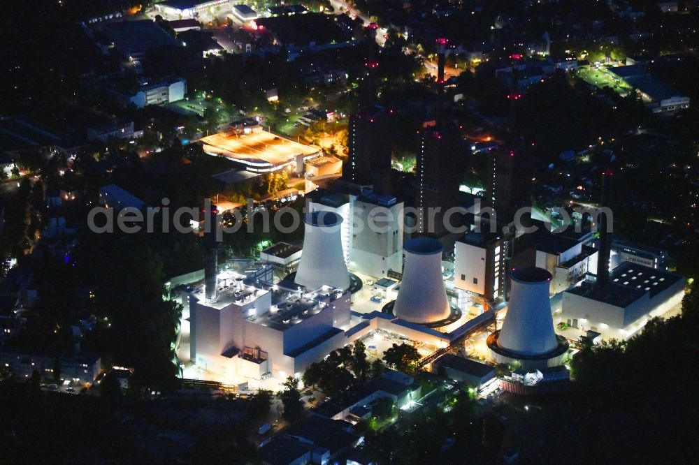 Aerial photograph at night Berlin - Night lighting power plants and exhaust towers of thermal power station Vattenfall Heizkraftwerk Lichterfelde on Ostpreussendonm in Berlin, Germany