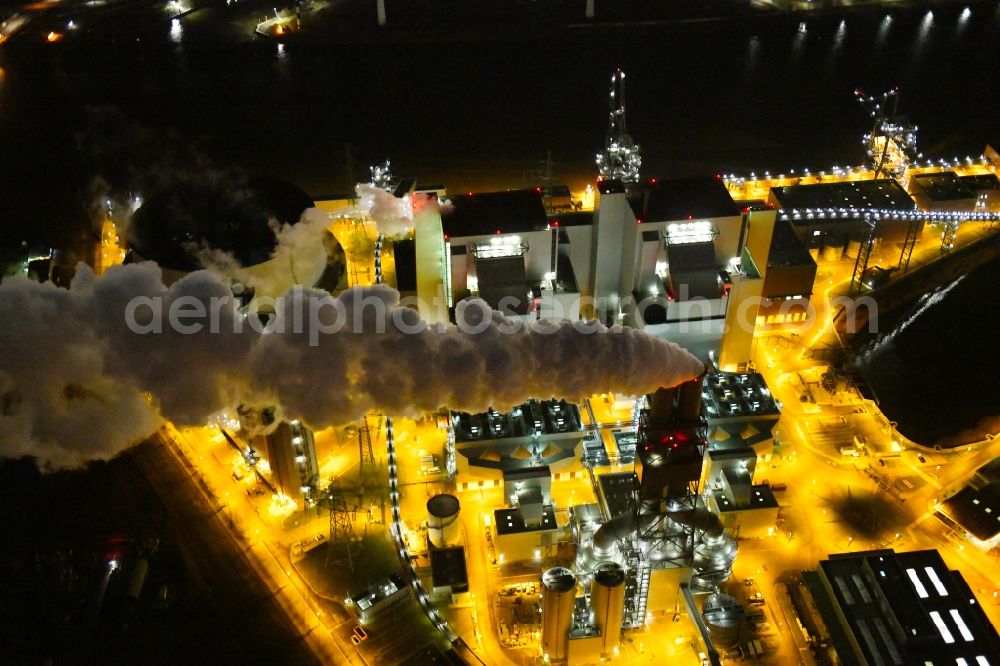 Hamburg at night from the bird perspective: Night lighting power plants and exhaust towers of thermal power station Vattenfall Tiefstack in Hamburg Moorburg, Germany