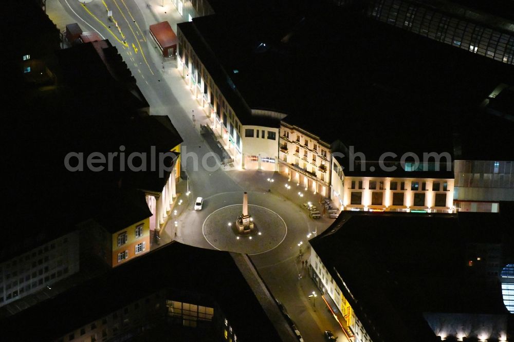 Aerial image at night Karlsruhe - Night lighting circular surface - Place Rondellplatz on shopping mall Ettliner Tor in Karlsruhe in the state Baden-Wurttemberg, Germany