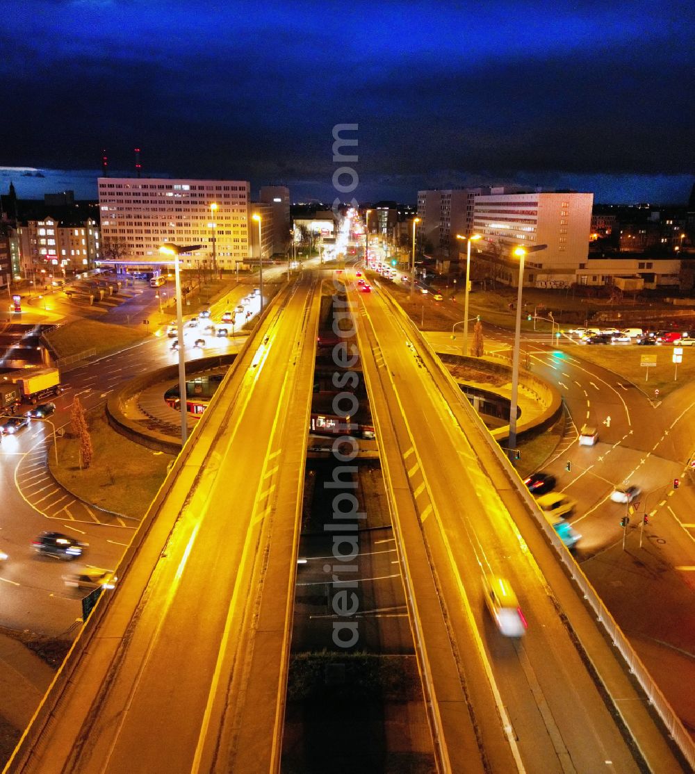 Aerial image at night Halle (Saale) - Night lighting traffic management of the roundabout road of Franckestrasse in Halle (Saale) in the state Saxony-Anhalt, Germany
