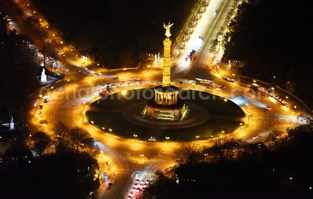 Aerial image at night Berlin - Night view traffic management of the roundabout road at the Victory Column - Big Star in the park area of the Tiergarten in Berlin in Germany