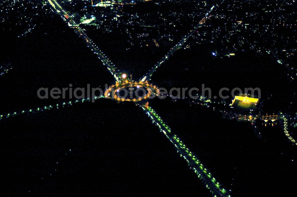 Aerial photograph at night Berlin - Night view traffic management of the roundabout road at the Victory Column - Big Star in the park area of the Tiergarten in Berlin in Germany