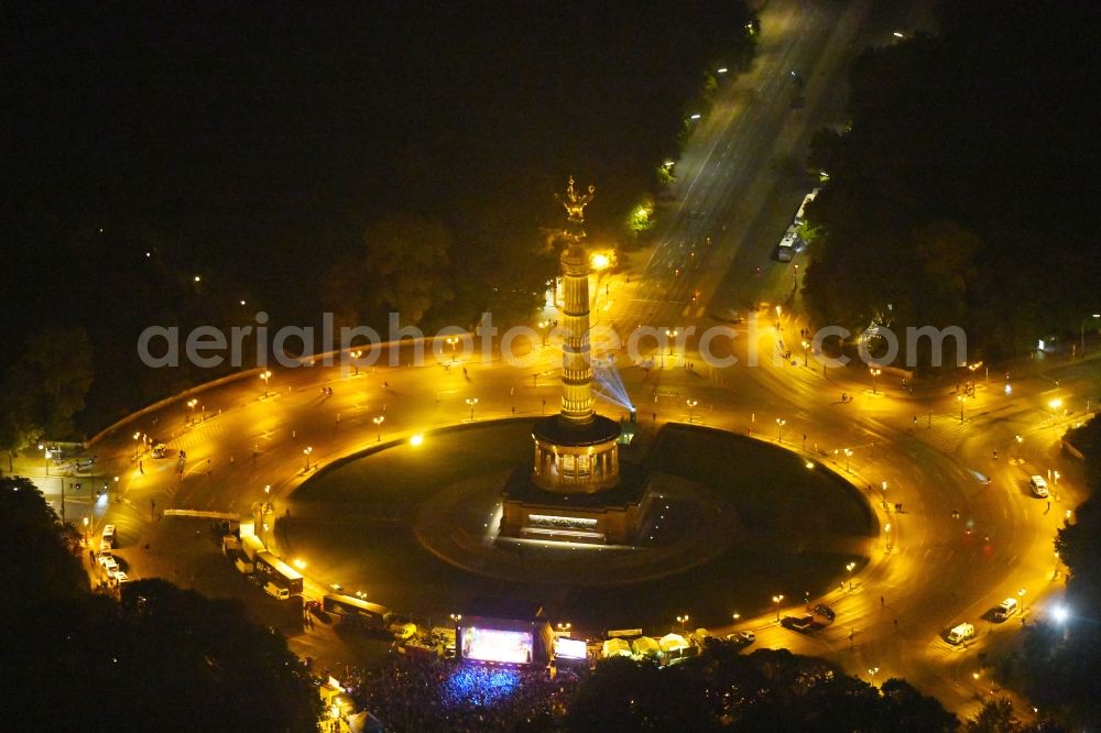 Aerial photograph at night Berlin - Night lighting Traffic management of the roundabout road at the Victory Column - Big Star in the park area of the Tiergarten in Berlin in Germany
