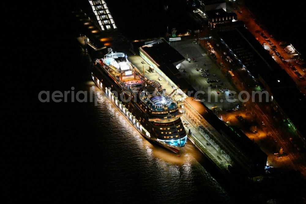 Hamburg at night from the bird perspective: Night lights and lighting of the cruise passenger and passenger ship AIDAsol on the quay of the Cruise Center in the district Altonaer Fischmarkt in Hamburg, Germany