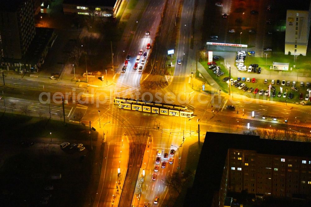 Berlin at night from the bird perspective: Night lighting road over the crossroads Rhinstrasse - Allee of Kosmonauten in the district Marzahn in Berlin, Germany