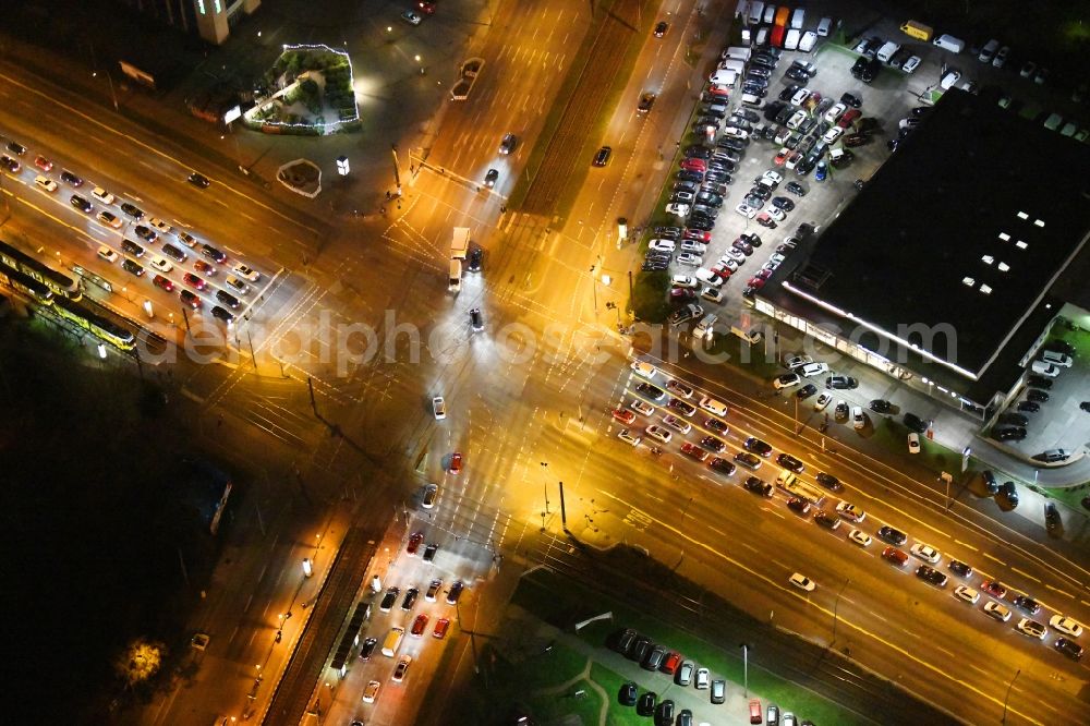 Aerial photograph at night Berlin - Night lighting road over the crossroads Rhinstrasse corner Landsberger Allee in the district Marzahn in Berlin, Germany