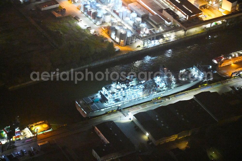 Aerial photograph at night Hamburg - Night lighting Ship of the German Navy Berlin A 1411 in the port of Hamburg, Germany