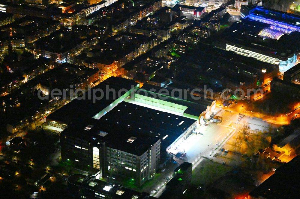 Aerial image at night Berlin - Night lighting warehouses and forwarding building of Amazon Transport GmbH - UDE6 in the district Reinickendorf in Berlin, Germany