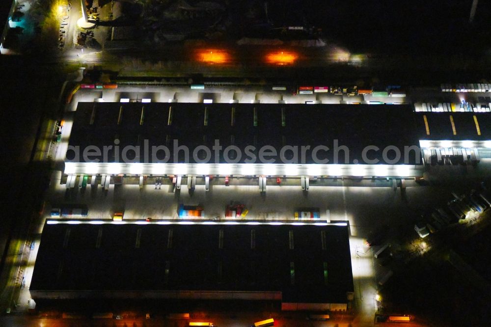 Aerial image at night Hamburg - Night lighting warehouses and forwarding building Am Genter Ufer in the district Waltershof in Hamburg, Germany