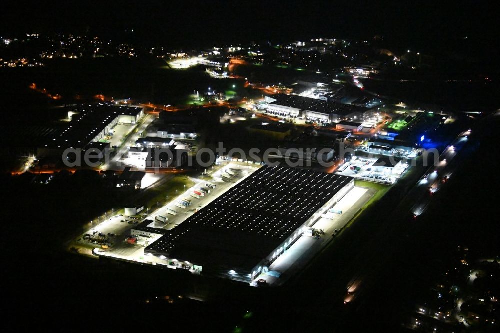 Siek at night from above - Night lighting warehouses and forwarding building LIDL Zentrallager Siek on Jacobsrade in the district Meilsdorf in Siek in the state Schleswig-Holstein, Germany