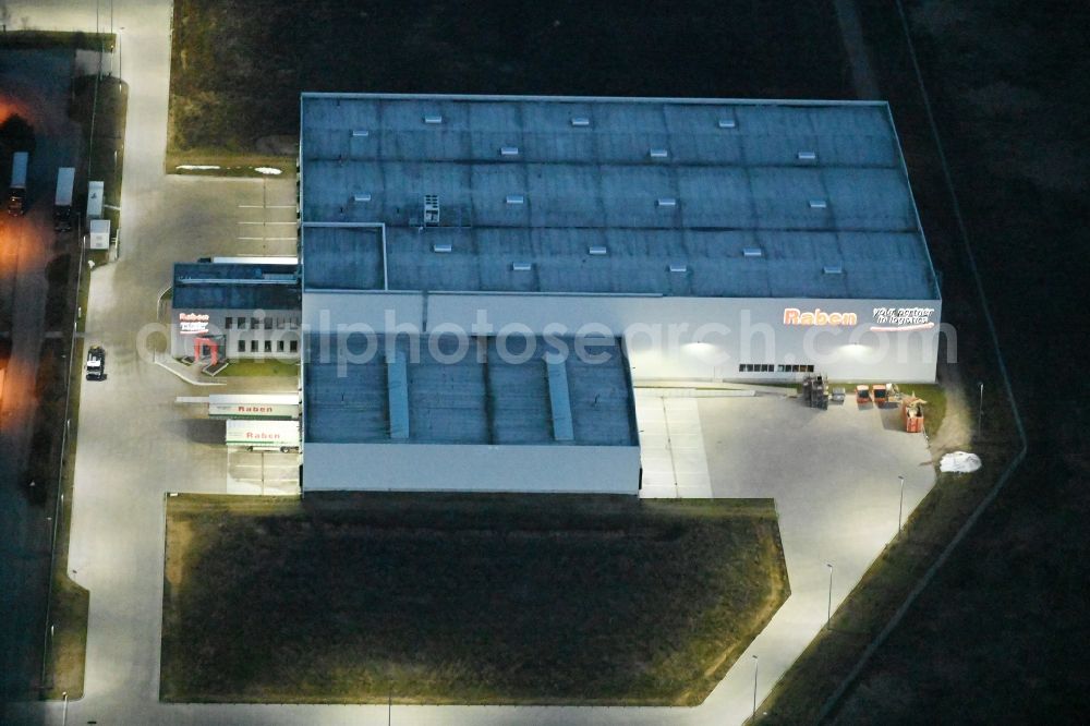Aerial photograph at night Fahrbinde - Night lighting warehouses and forwarding building of Raben Trans European Germany in Fahrbinde in the state Mecklenburg - Western Pomerania, Germany