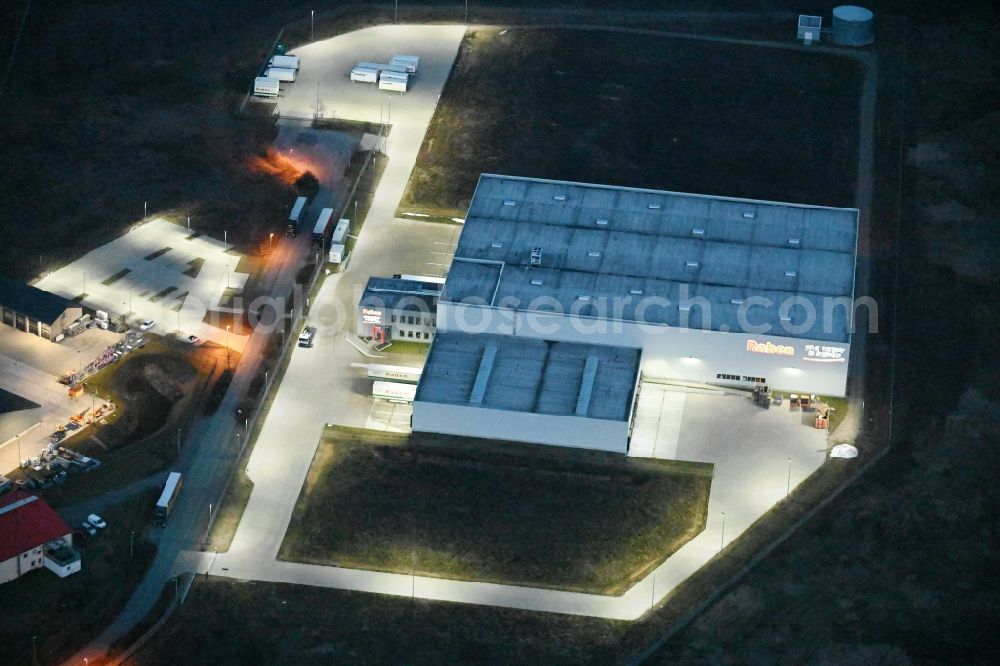 Aerial image at night Fahrbinde - Night lighting warehouses and forwarding building of Raben Trans European Germany in Fahrbinde in the state Mecklenburg - Western Pomerania, Germany