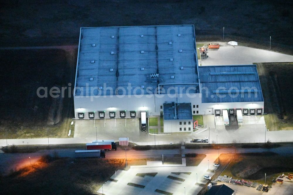 Fahrbinde at night from the bird perspective: Night lighting warehouses and forwarding building of Raben Trans European Germany in Fahrbinde in the state Mecklenburg - Western Pomerania, Germany