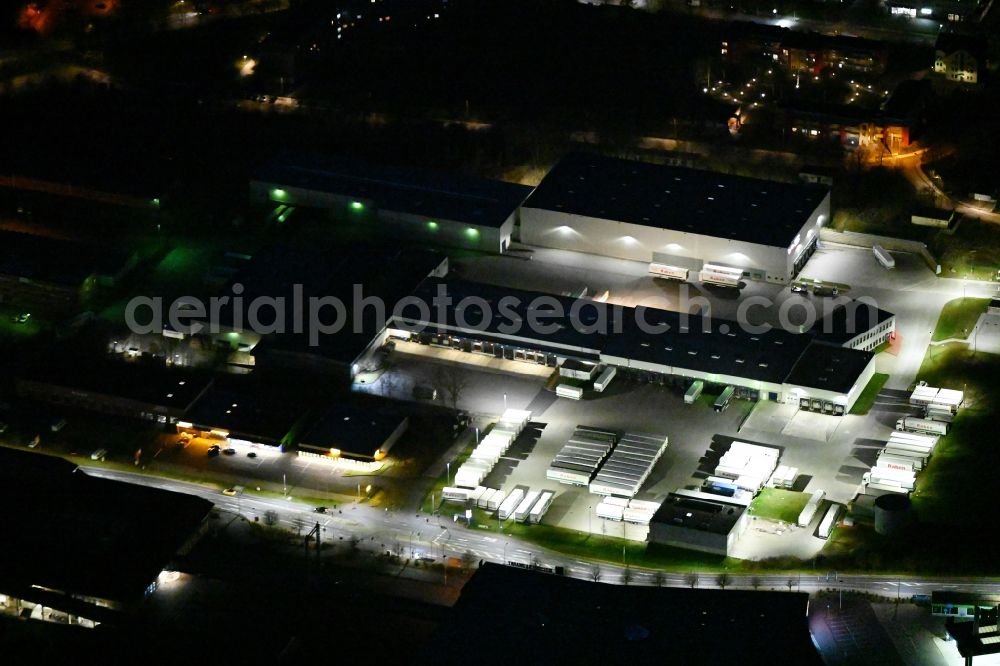 Aerial image at night Eisenach - Night lighting warehouses and forwarding building of Raben Trans European Germany GmbH in Eisenach in the Thuringian Forest in the state Thuringia, Germany