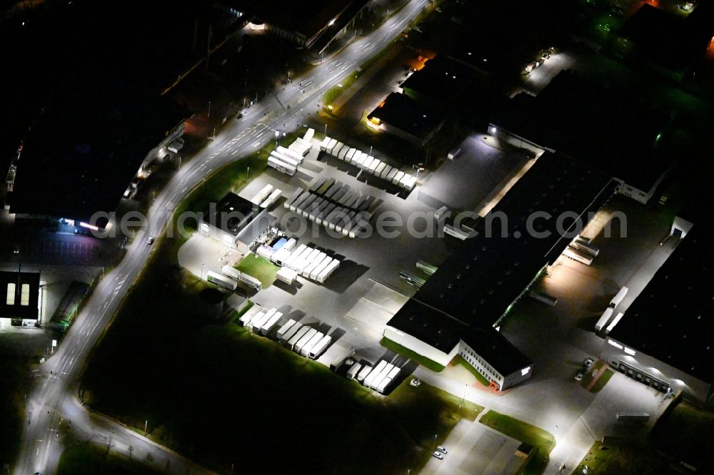 Eisenach at night from above - Night lighting warehouses and forwarding building of Raben Trans European Germany GmbH in Eisenach in the Thuringian Forest in the state Thuringia, Germany