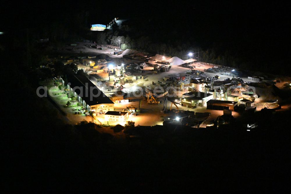 Aerial image at night Eberswalde - Night lighting logistics yard of the scrap - recycling sorting plant Theo Steil in Eberswalde in the state Brandenburg, Germany