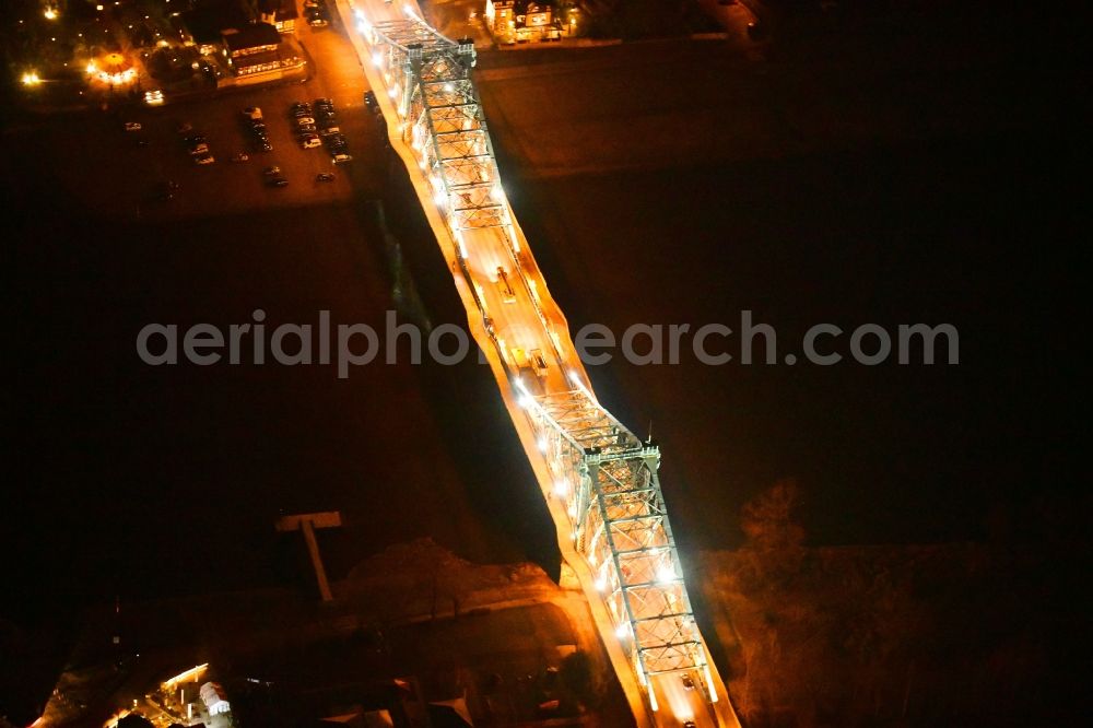 Aerial image at night Dresden - Night lighting the Loschwitzer bridge called Blue Miracle over the river Elbe in Dresden in the state Saxony. The bridge connects the districts Blasewitz and Loschwitz and is a well known landmark in Dresden