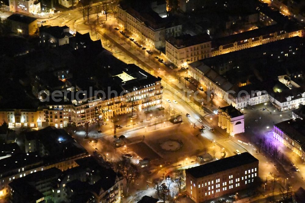 Aerial photograph at night Potsdam - Night view ensemble space Luisenplatz in the inner city center in Potsdam in the state Brandenburg. The square with the fountain and the Brandenburg Gate on the end of the Brandenburger Strasse