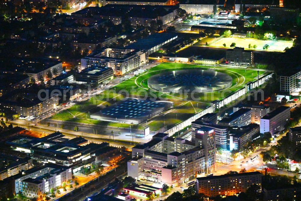Aerial photograph at night Berlin - Night lighting view to the Velodrome at the Landsberger Allee in the Berlin district Prenzlauer Berg. The Velodrome is one of the largest event halls of Berlin and is used for sport events, concerts and other events