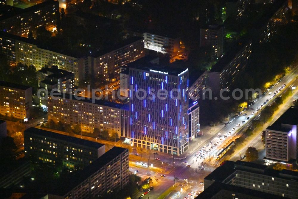 Berlin at night from the bird perspective: Night lighting Mercedes-Benz Bank Service Center high-rise construction on the corner of Otto-Braun-Strasse for the new residential and commercial building