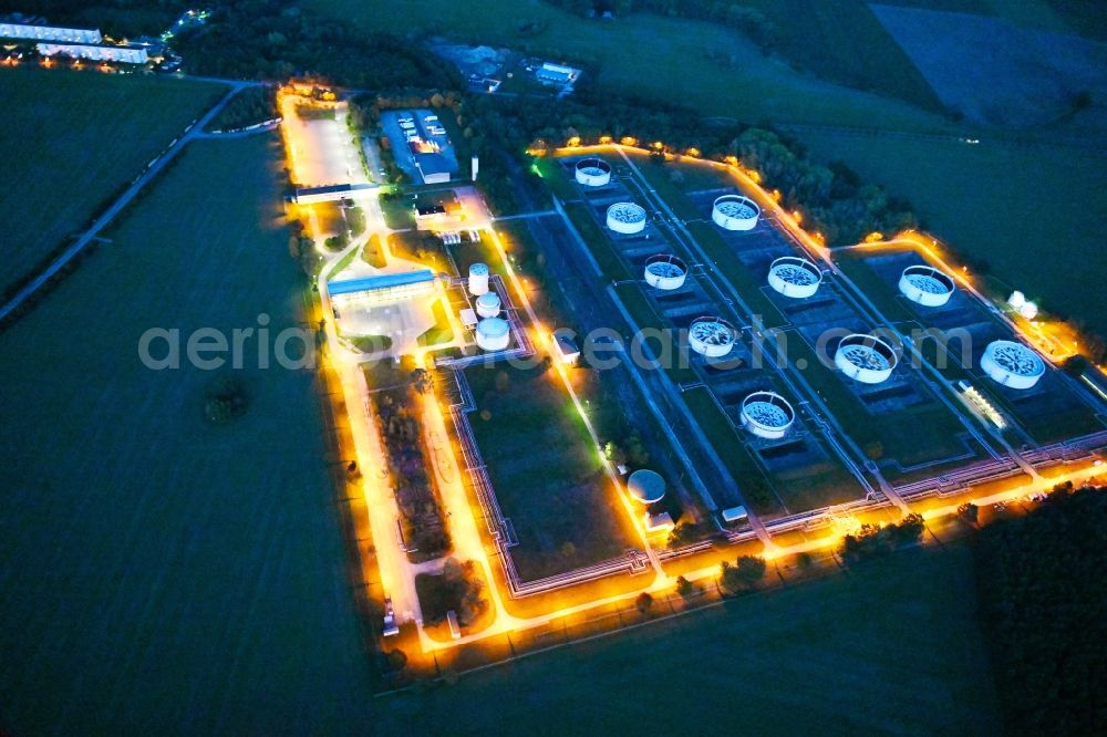 Seefeld-Löhme at night from the bird perspective: Night lighting mineral oil - high storage tanks for gasoline and diesel fuels in Seefeld in Brandenburg