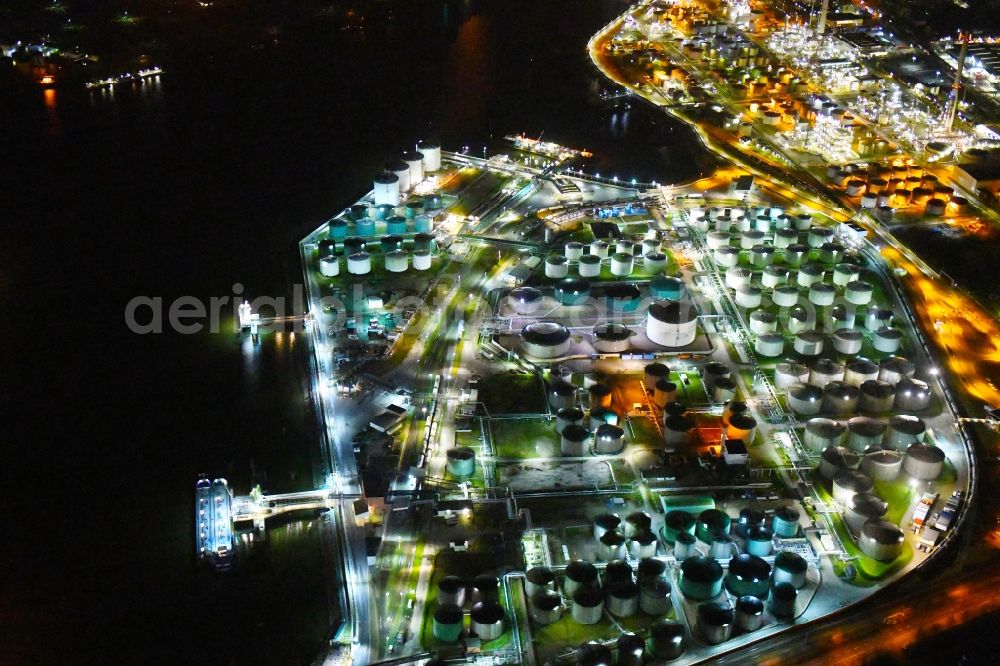 Aerial image at night Hamburg - Night lighting mineral oil - tank on Oelhafen in Hamburg, Germany