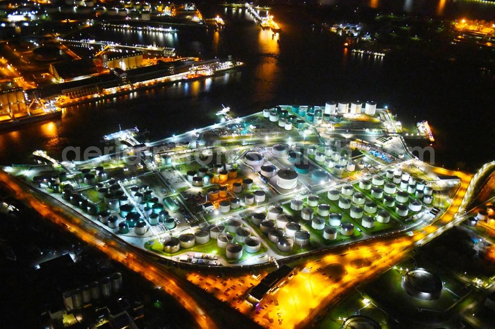 Aerial image at night Hamburg - Night lighting mineral oil - tank on Oelhafen in Hamburg, Germany